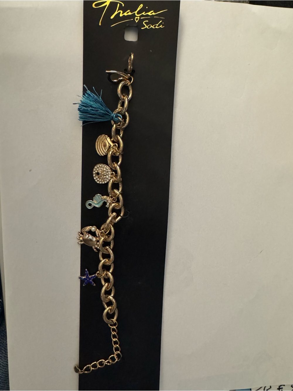 Thalia Sodi Gold-Tone Charm Bracelet with Teal Tassel and Blue Star